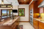 The kitchen features all luxury, high-end stainless steel appliances